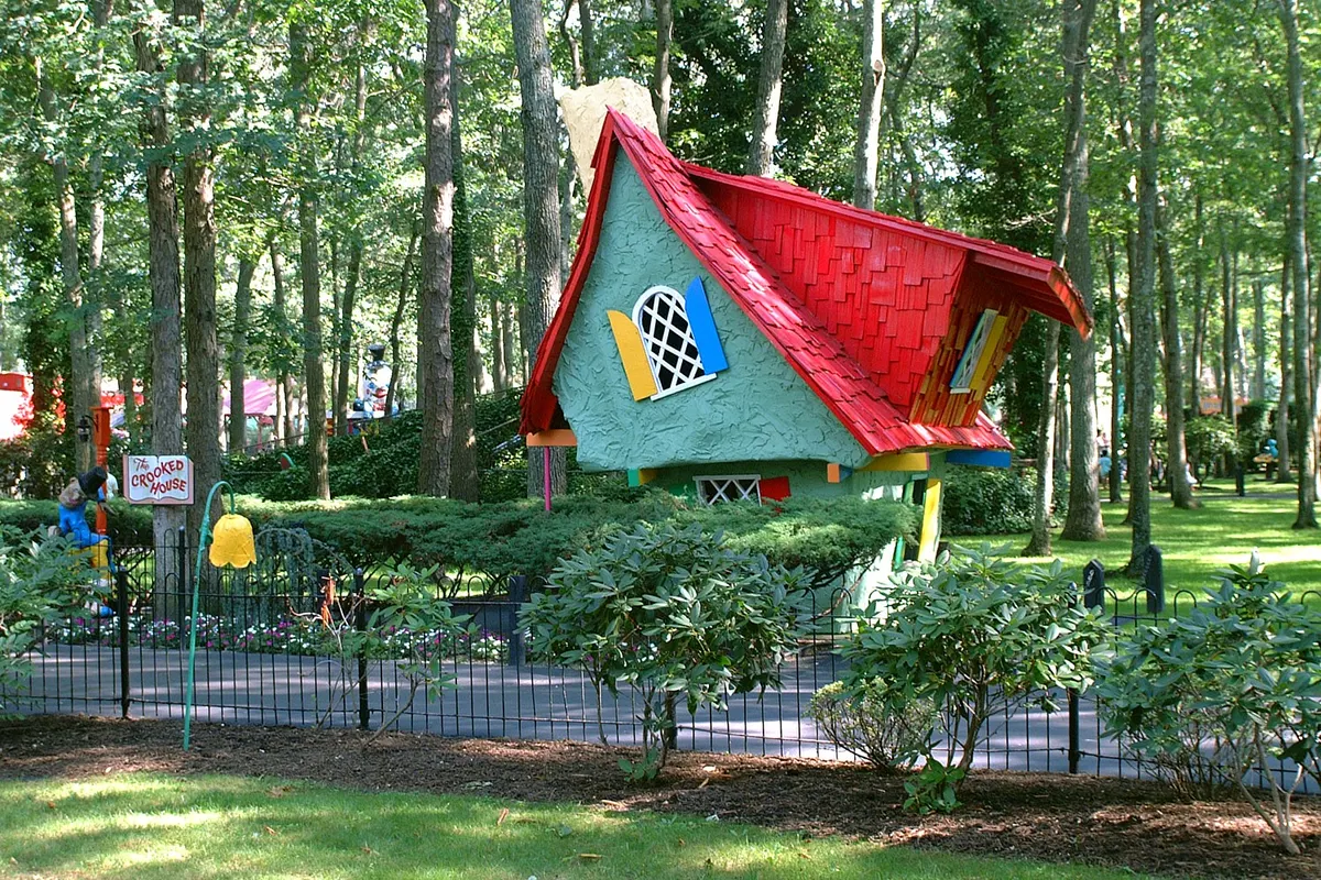A storybook cottage with a red roof at Storybook Land